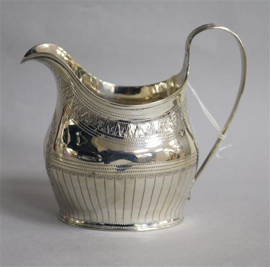 A George III silver helmet shaped cream jug, London, 1903, 11cm.